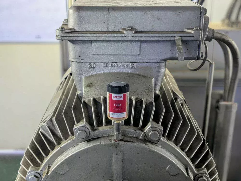 Dispensador de perma que se utiliza en una máquina