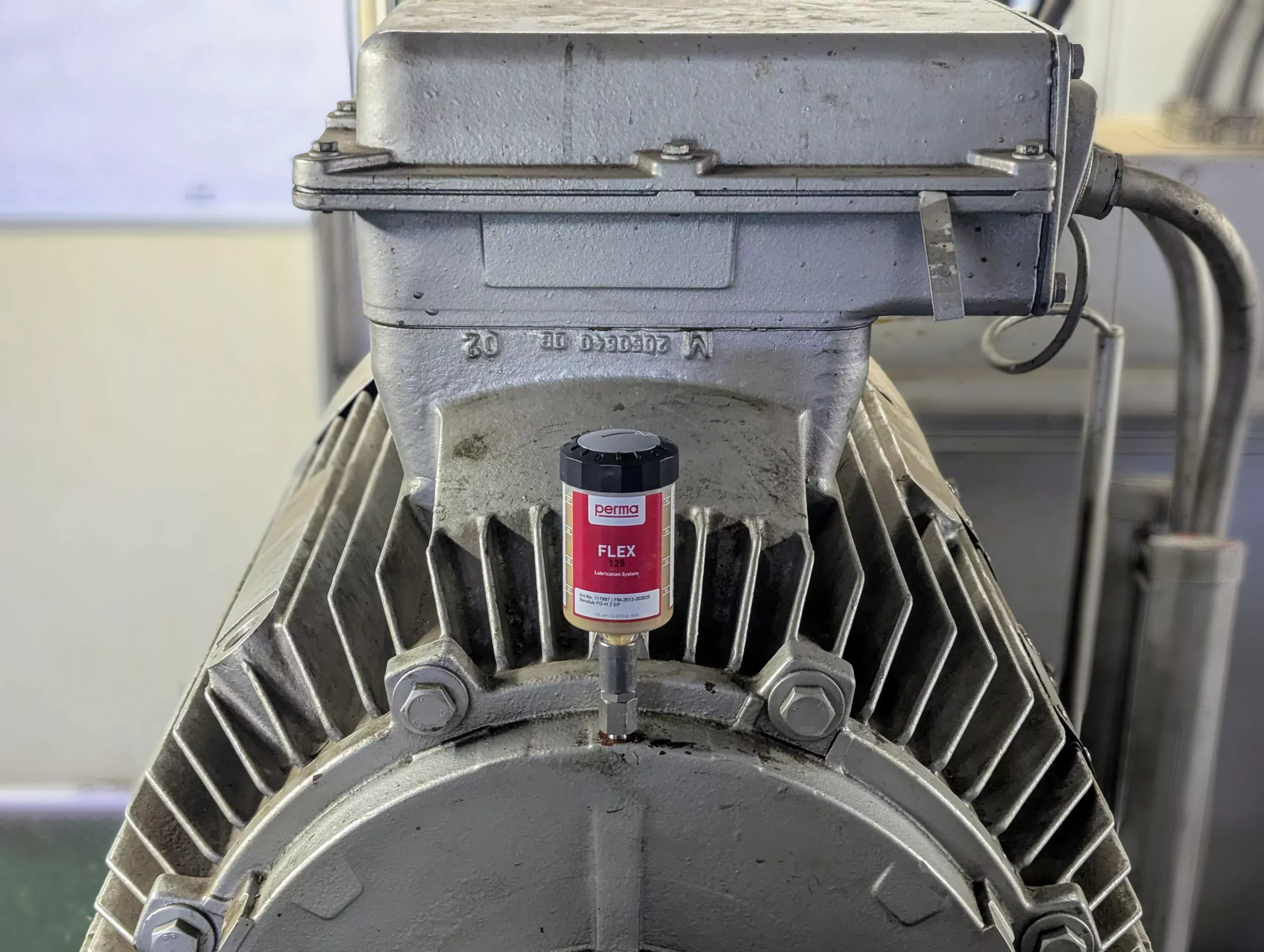 Dispensador de perma que se utiliza en una máquina